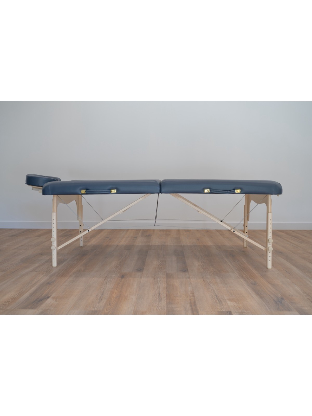 Table de massage Lunian 80 avec rembourrage bleu, offrant un soutien supérieur et un design élégant.