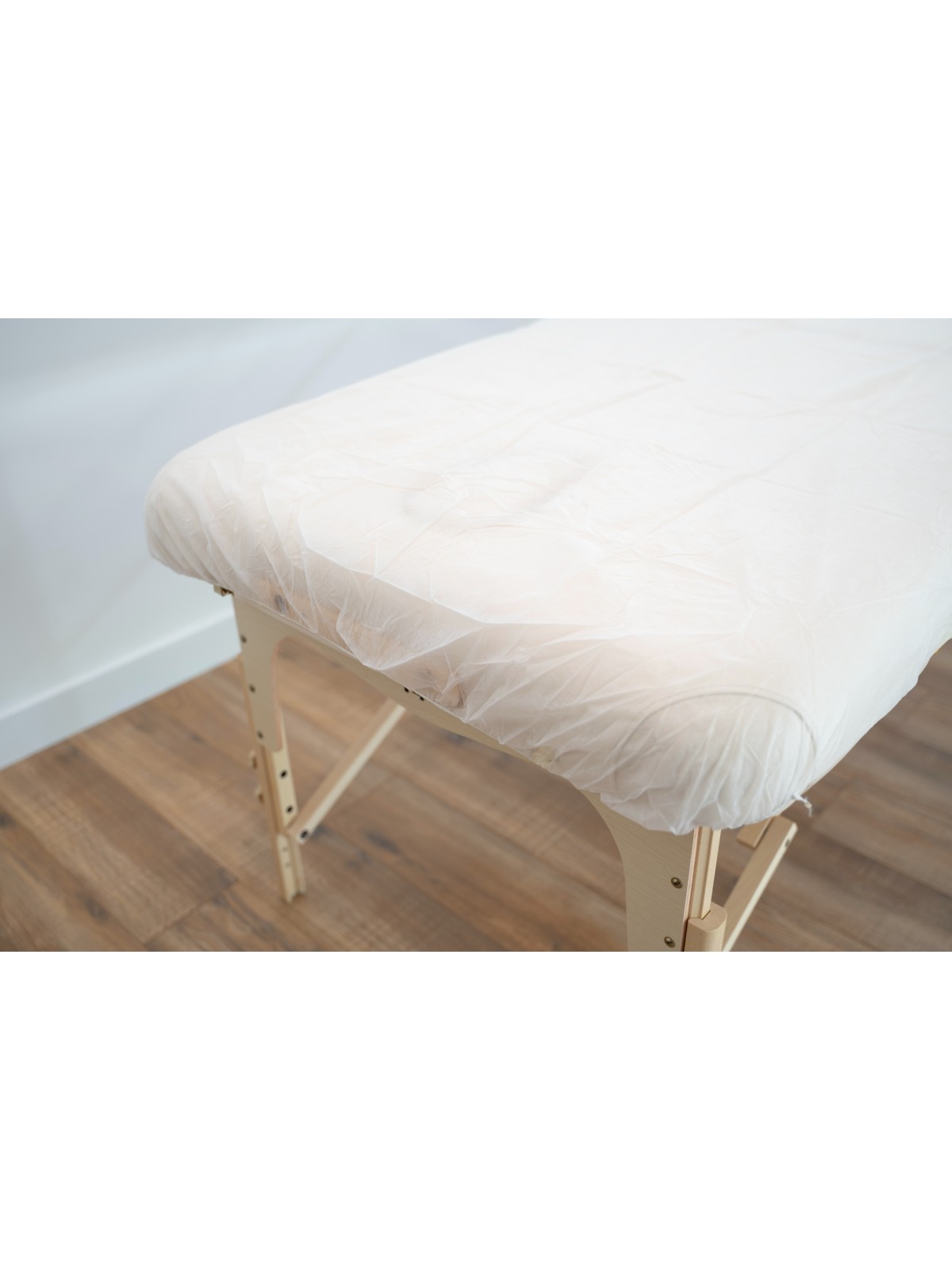 Protection de table de massage jetable, offrant une barrière hygiénique et pratique pour chaque séance de soin.