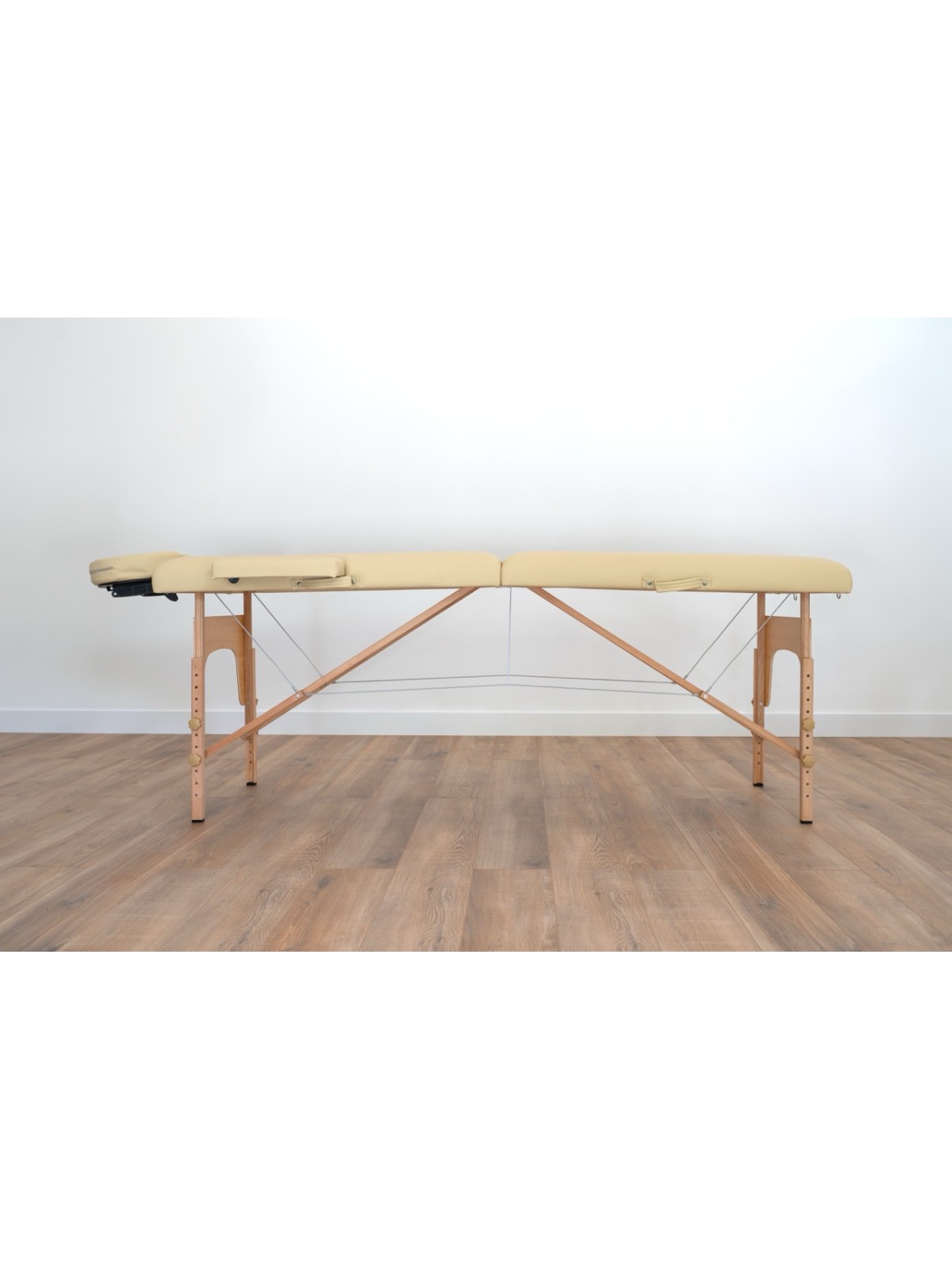 Vue latérale de la table de massage Sofia Light, avec structure ergonomique pour soins professionnels.