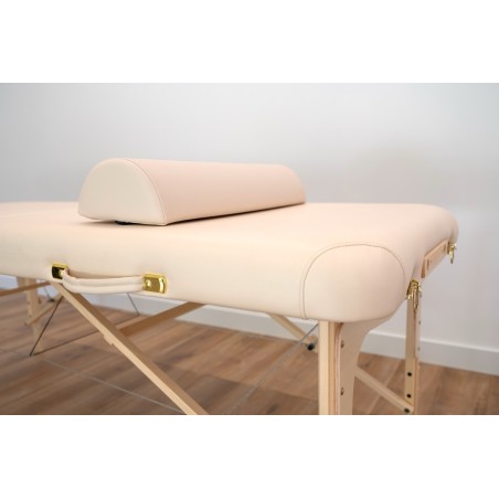 Coussin demi-cylindre beige pour table de massage, offrant un soutien ergonomique pour le cou et les jambes.